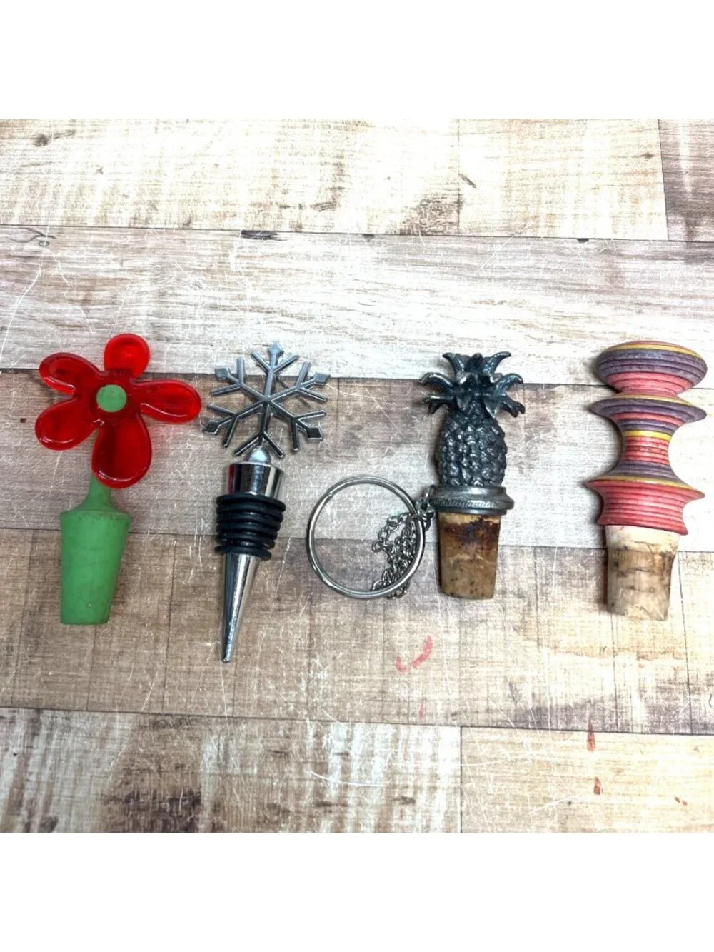 4 Unique Bottle Stoppers With Pineapple Snowflake Flower And Abstract Designs